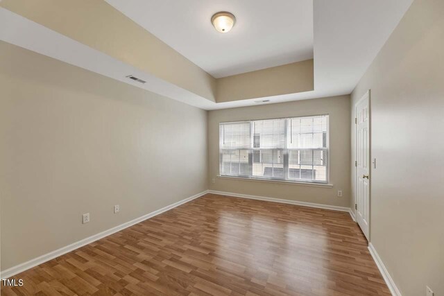 empty room with wood-type flooring