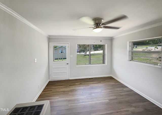 interior space with ceiling fan, dark hardwood / wood-style flooring, and crown molding