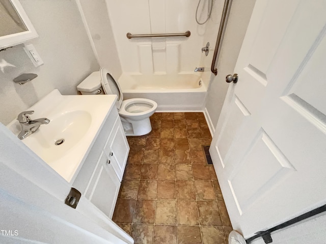 full bath featuring visible vents, toilet, bathing tub / shower combination, stone finish floor, and vanity