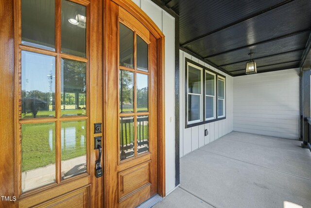 exterior space featuring a porch and a water view