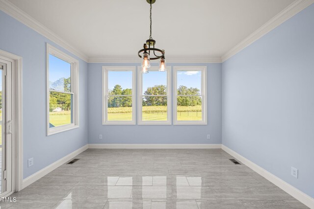 unfurnished dining area featuring crown molding and an inviting chandelier