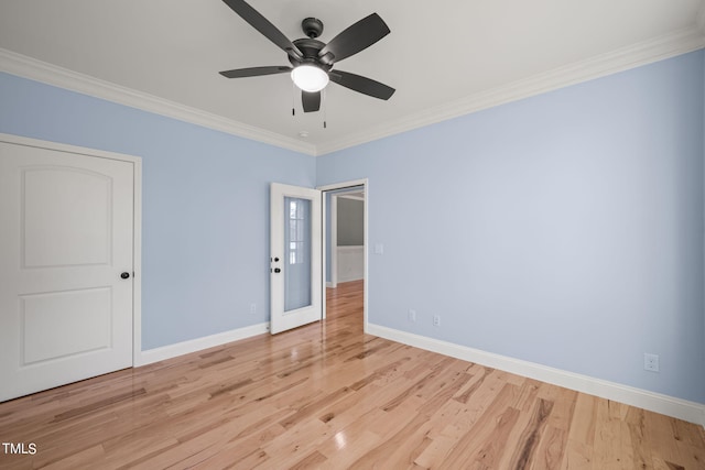 2804 Jack Mitchell Rd, Zebulon, NC 27597 - empty room featuring a ceiling fan, ornamental molding, baseboards, and wood finished floors