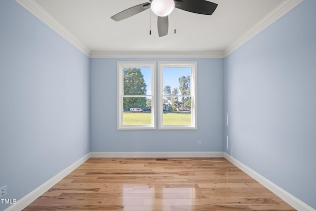 empty room with ornamental molding, ceiling fan, and light hardwood / wood-style floors