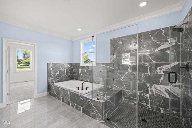 bathroom with crown molding and independent shower and bath