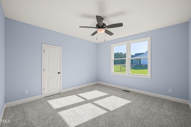 2804 Jack Mitchell Rd, Zebulon, NC 27597 - carpeted empty room with baseboards, visible vents, and a ceiling fan