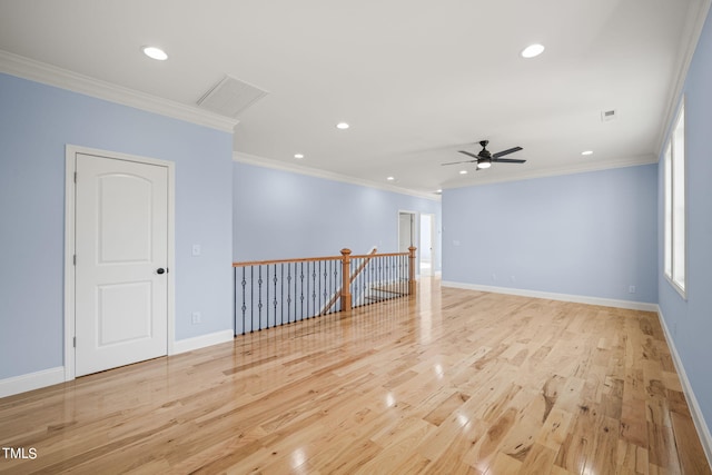 2804 Jack Mitchell Rd, Zebulon, NC 27597 - unfurnished room featuring light wood finished floors, baseboards, ornamental molding, and a ceiling fan