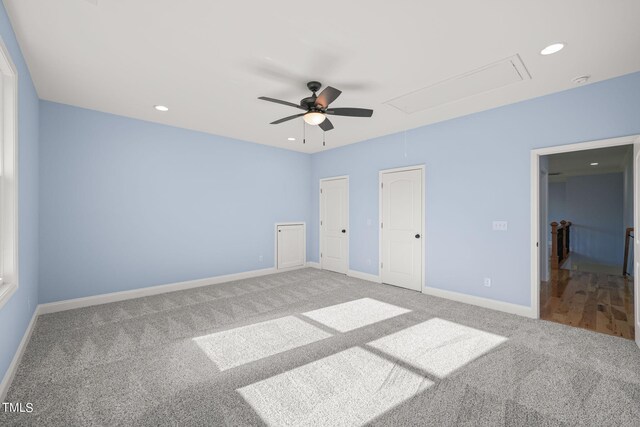 unfurnished bedroom with ceiling fan and carpet