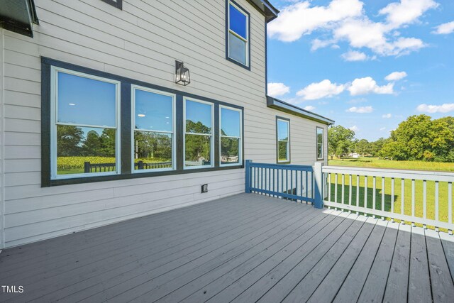 wooden deck with a yard