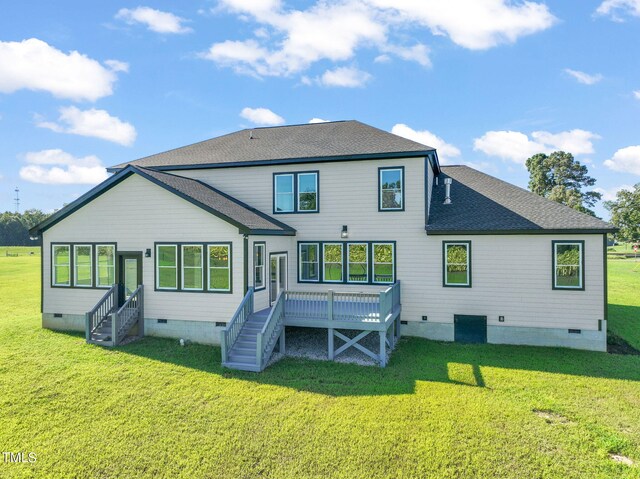 rear view of house with a lawn