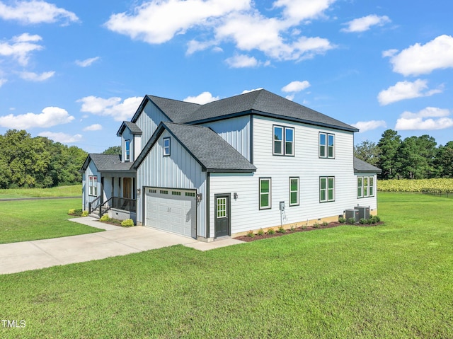 2804 Jack Mitchell Rd, Zebulon, NC 27597 - exterior space featuring a lawn, board and batten siding, concrete driveway, and roof with shingles