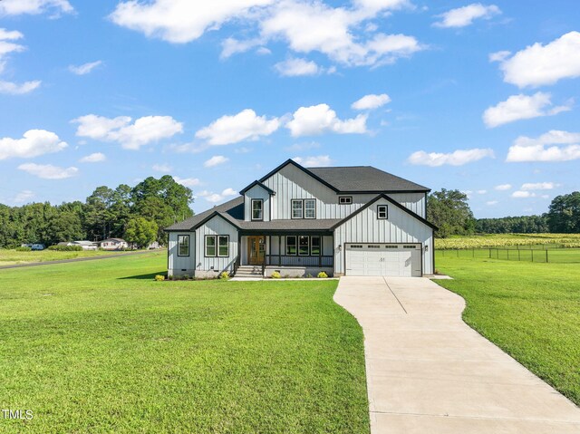 modern farmhouse featuring a front yard and a porch