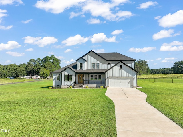 2804 Jack Mitchell Rd, Zebulon, NC 27597 - modern inspired farmhouse featuring board and batten siding, a front yard, driveway, and an attached garage