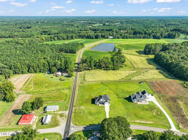 aerial view with a water view and a rural view