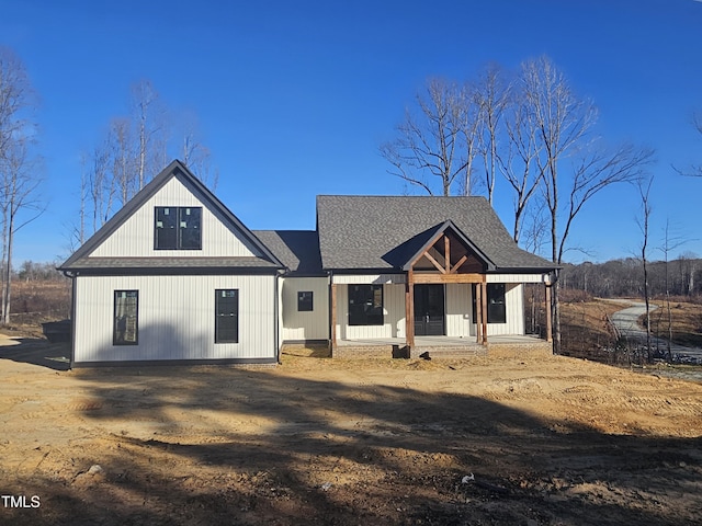 modern inspired farmhouse with a porch