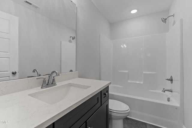 full bathroom featuring tile patterned floors, toilet, vanity, and washtub / shower combination