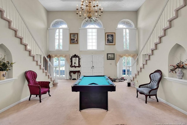 game room with light carpet, a wealth of natural light, and pool table