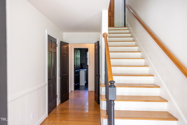 stairway featuring hardwood / wood-style floors