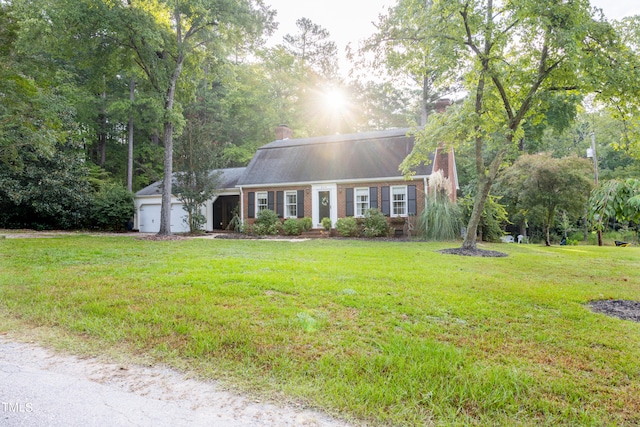 cape cod-style house with a garage and a front yard