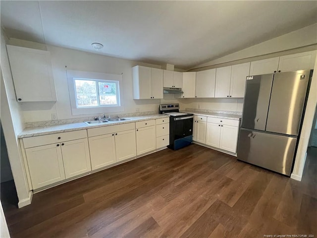 kitchen featuring dark hardwood / wood-style flooring, stainless steel appliances, vaulted ceiling, sink, and white cabinetry