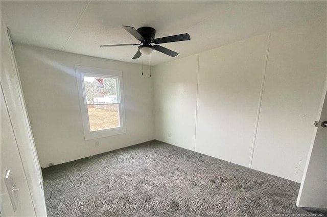 carpeted empty room with ceiling fan