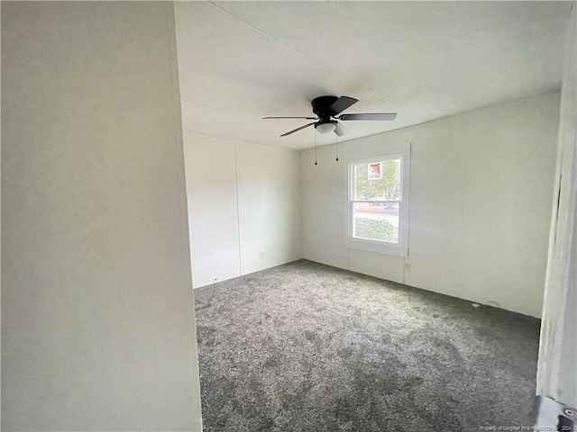 empty room featuring ceiling fan and carpet floors