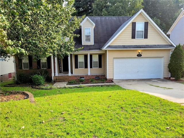 view of front of property with a garage and a front yard