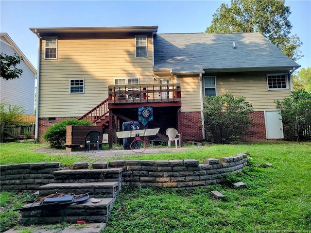 back of house with a lawn and a wooden deck