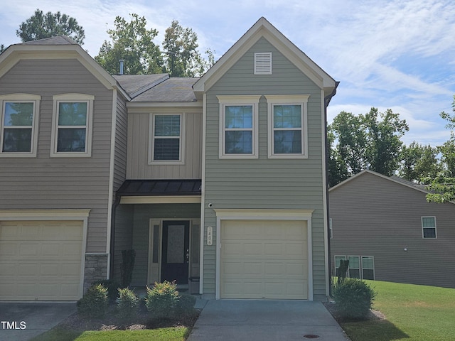 view of front of home featuring a garage and a front yard