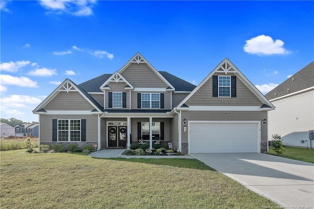 craftsman-style home with a garage and a front lawn