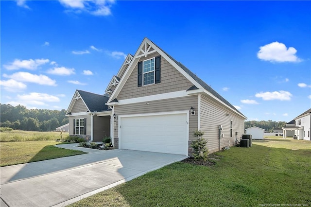 craftsman-style home featuring a garage, central AC, and a front yard