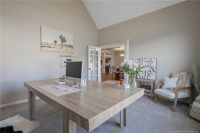 office area with french doors, high vaulted ceiling, and carpet