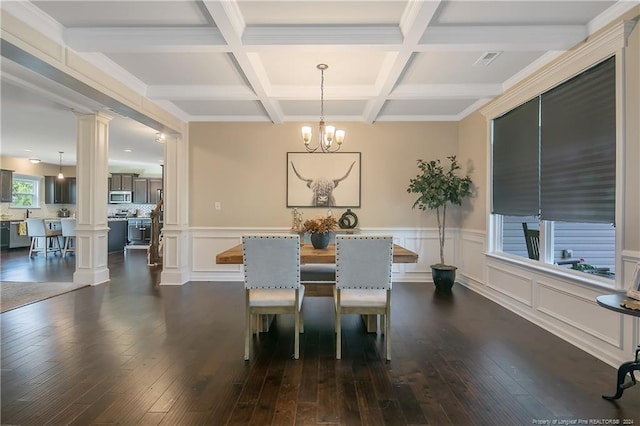 dining area with dark wood-type flooring, coffered ceiling, and ornate columns