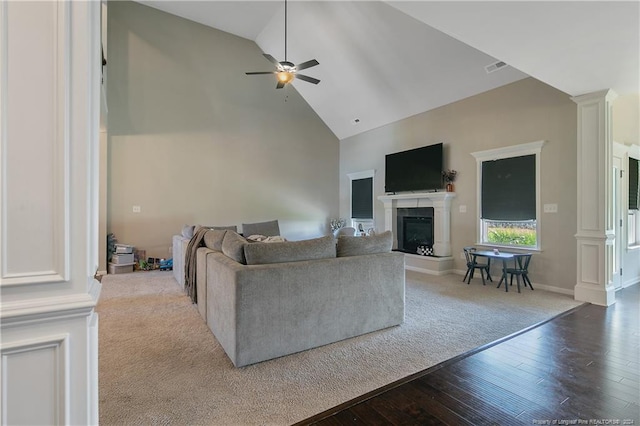 living room featuring high vaulted ceiling, ceiling fan, and wood-type flooring