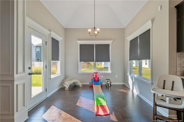 interior space with lofted ceiling, dark wood-type flooring, and a wealth of natural light