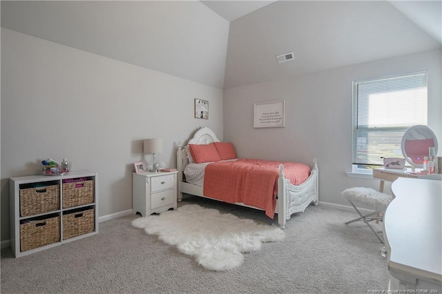 carpeted bedroom featuring vaulted ceiling