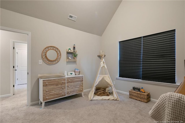 playroom with lofted ceiling and light colored carpet