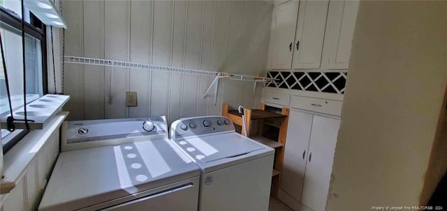 laundry room featuring washing machine and clothes dryer