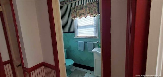 bathroom with vanity and toilet