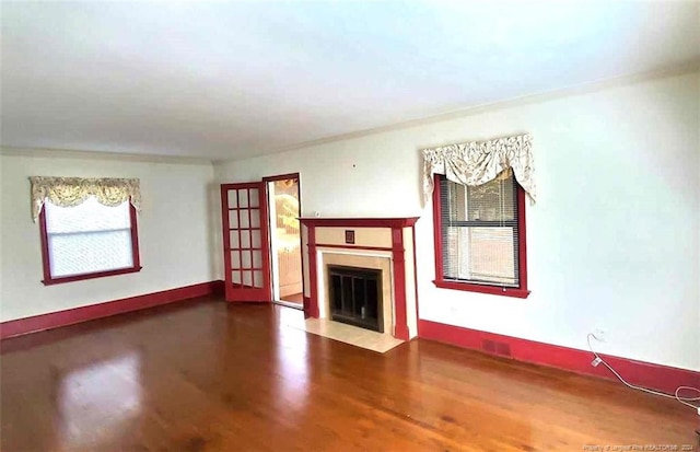 unfurnished living room with hardwood / wood-style floors