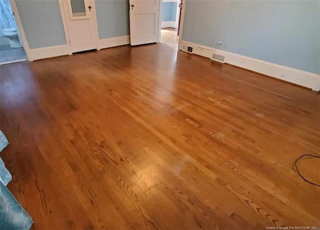 spare room featuring hardwood / wood-style floors