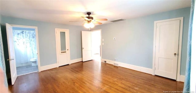 unfurnished bedroom featuring connected bathroom, ceiling fan, and dark hardwood / wood-style floors