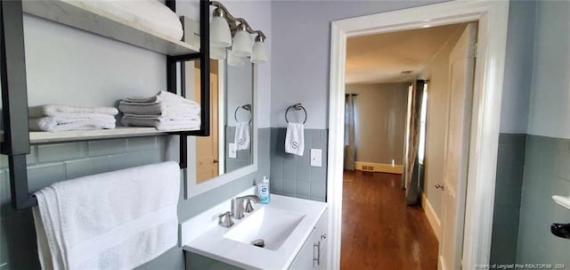 bathroom featuring hardwood / wood-style floors and vanity