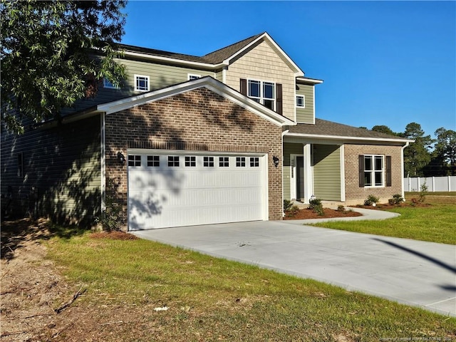 craftsman inspired home with a front yard and a garage