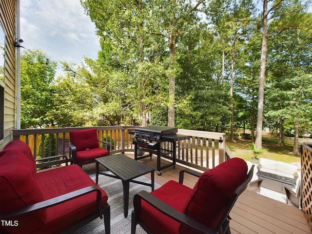 wooden terrace with an outdoor hangout area