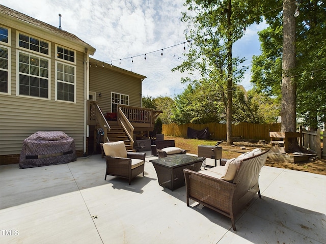 view of patio / terrace with an outdoor living space with a fire pit and a deck