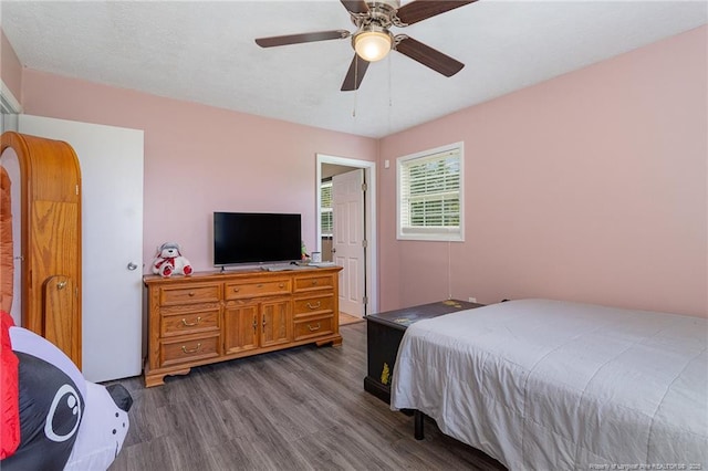 bedroom with hardwood / wood-style flooring and ceiling fan