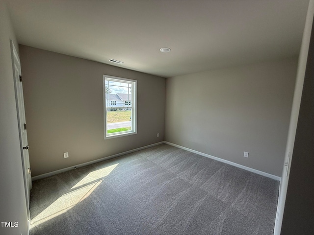 spare room featuring carpet flooring