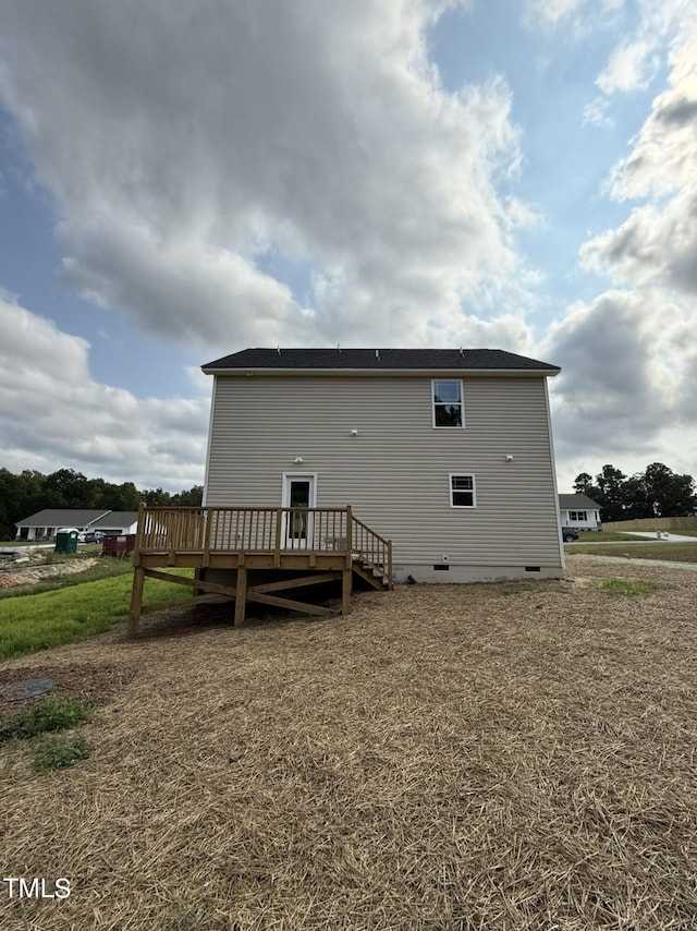 rear view of house featuring a deck