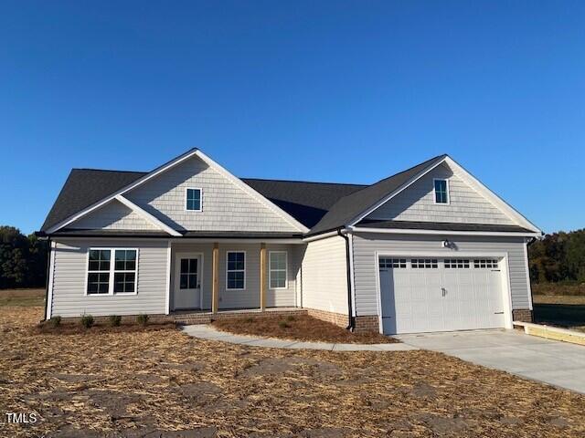 craftsman-style home featuring a garage and a porch