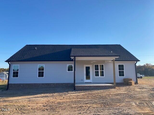 back of house with a patio